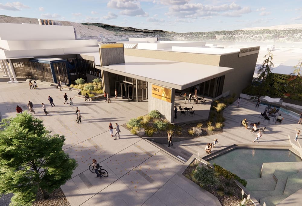 Modern community center with outdoor seating and landscaping.