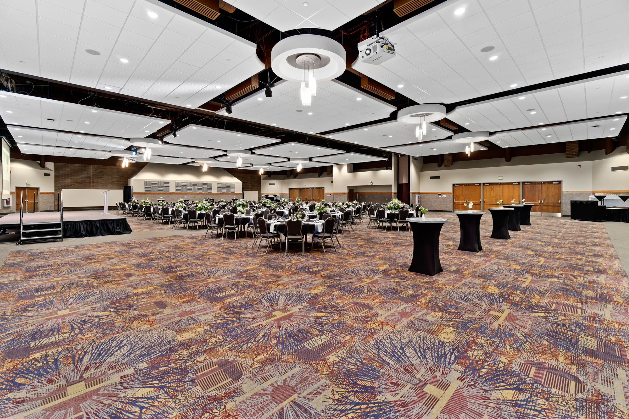 Spacious banquet hall set for an event.