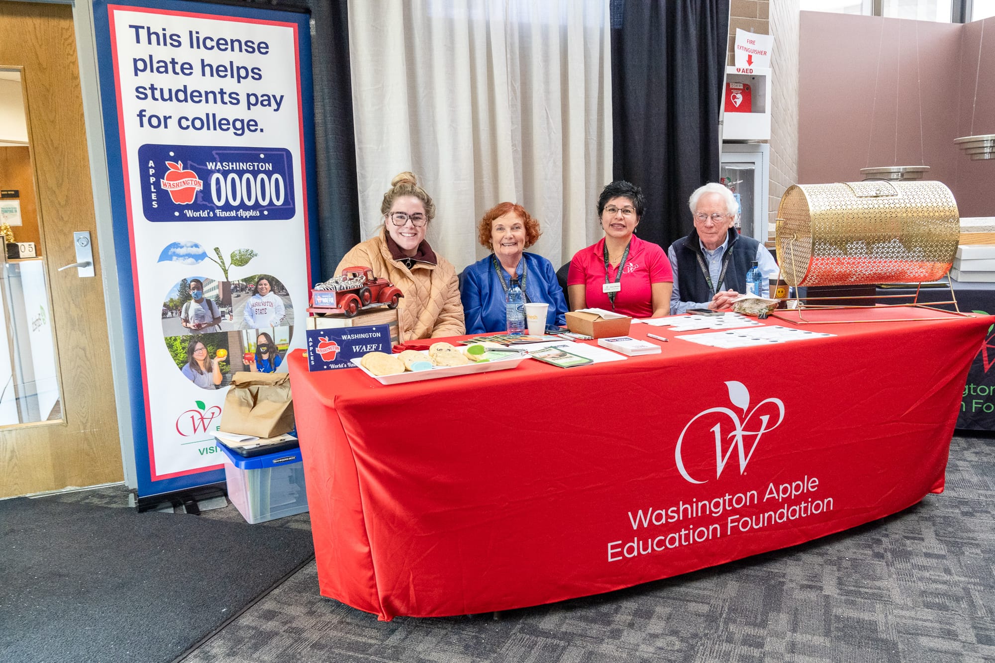 Washington Apple Education Foundation booth at college fair.